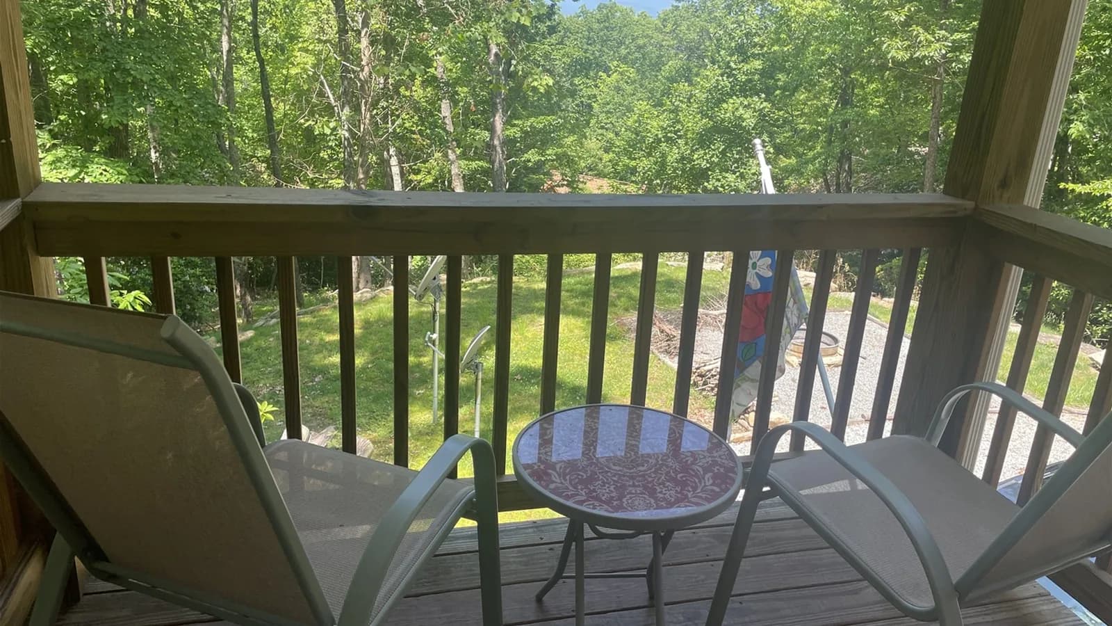 Whispering Trees Loft balcony seating among the trees