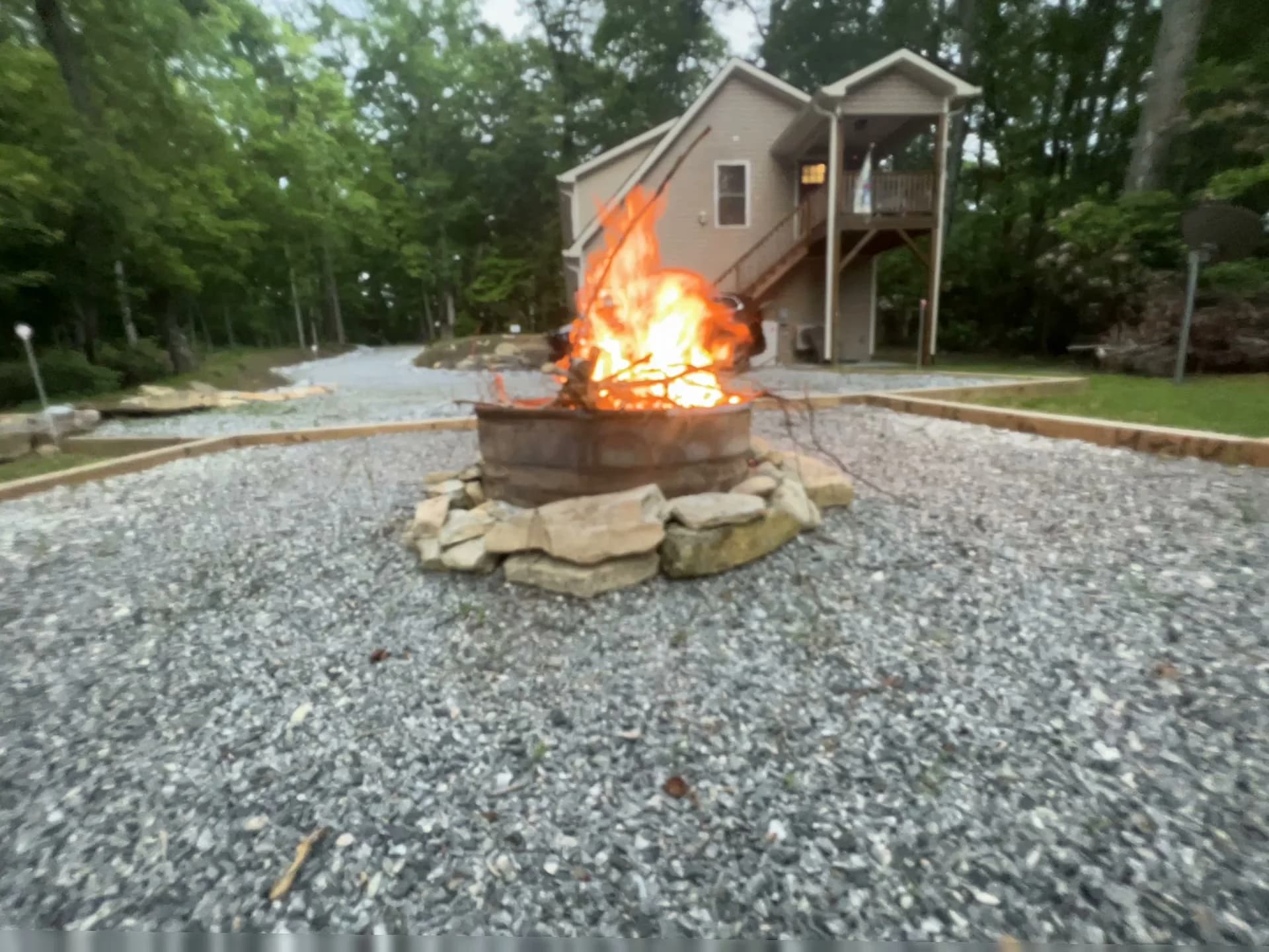 Whispering Trees Loft fire pit with the Loft beyond
