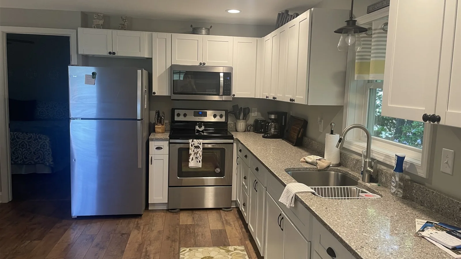 Whispering Trees Loft full kitchen with refrigerator, range, and dishwasher