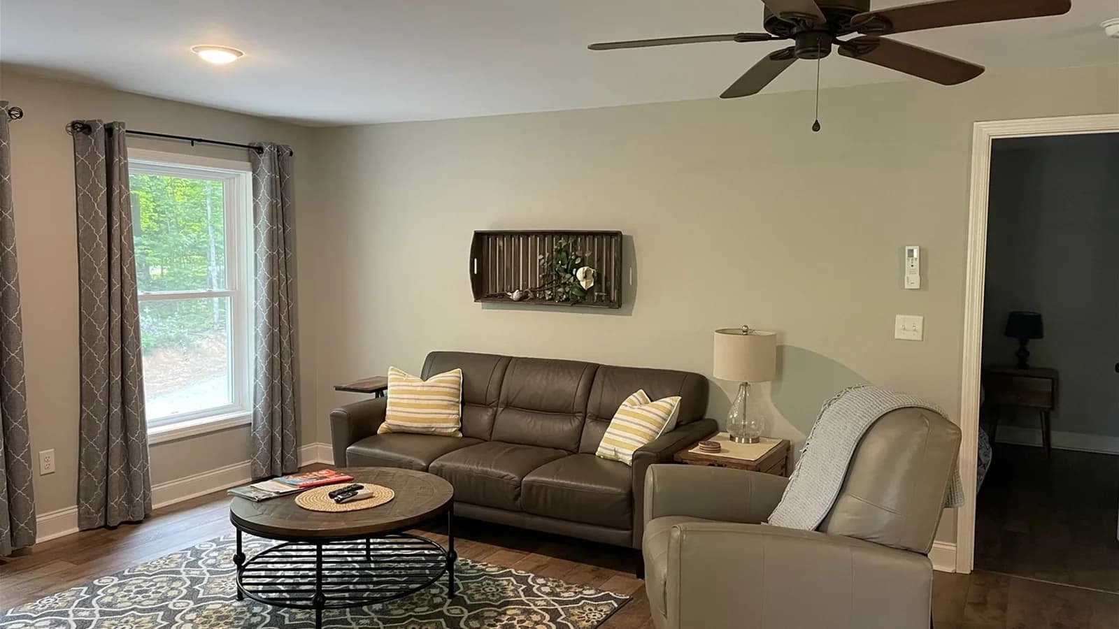 Whispering Trees Loft living area with sofa and armchair